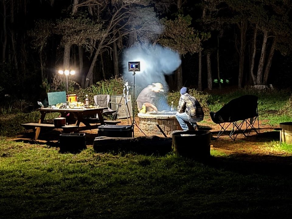Cooking over the fire at camp after dark