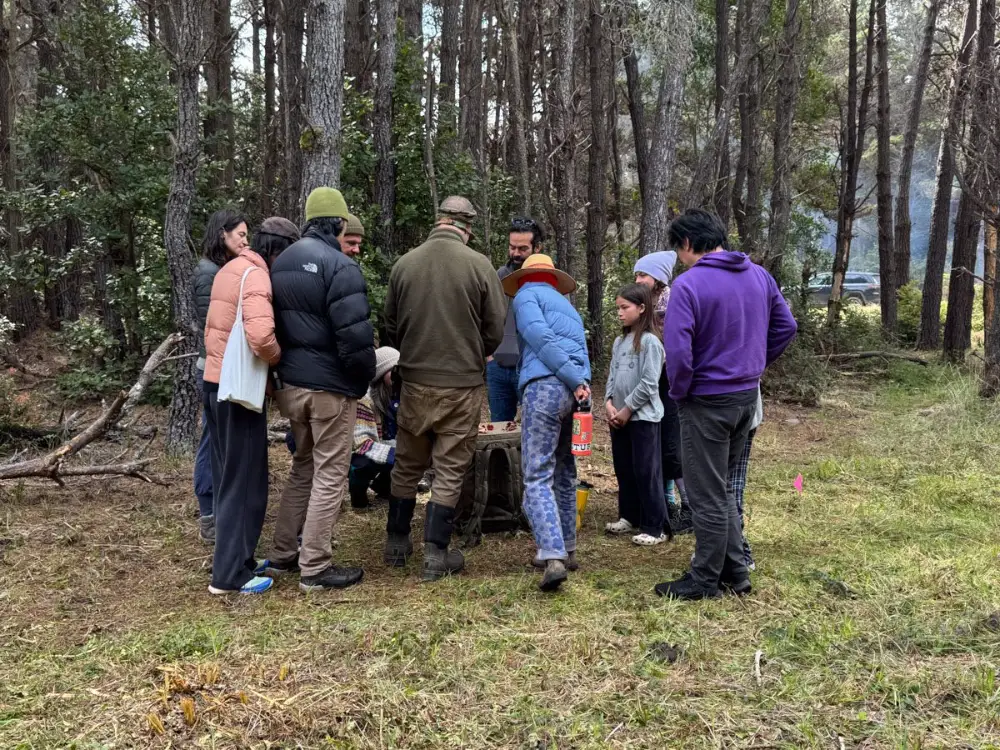 A guide and a group gathered in the coastal forest